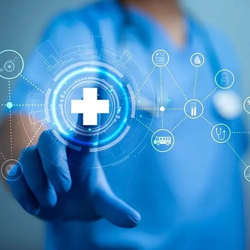 A gloved hand touching a connected network of hospital care services